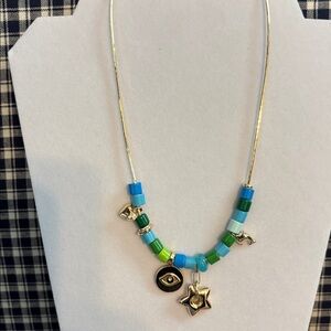 Anthropologie Gold and Green Charm necklace